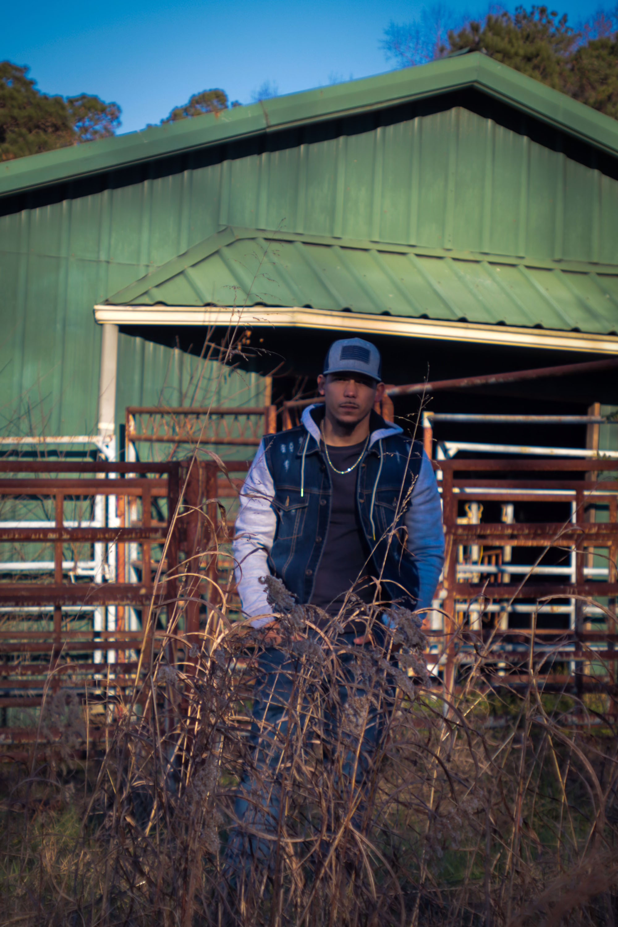 Keith Allen outside barn